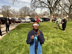Student looking at the eclipse